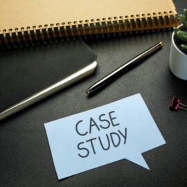 case study written in speech bubble on black office desk